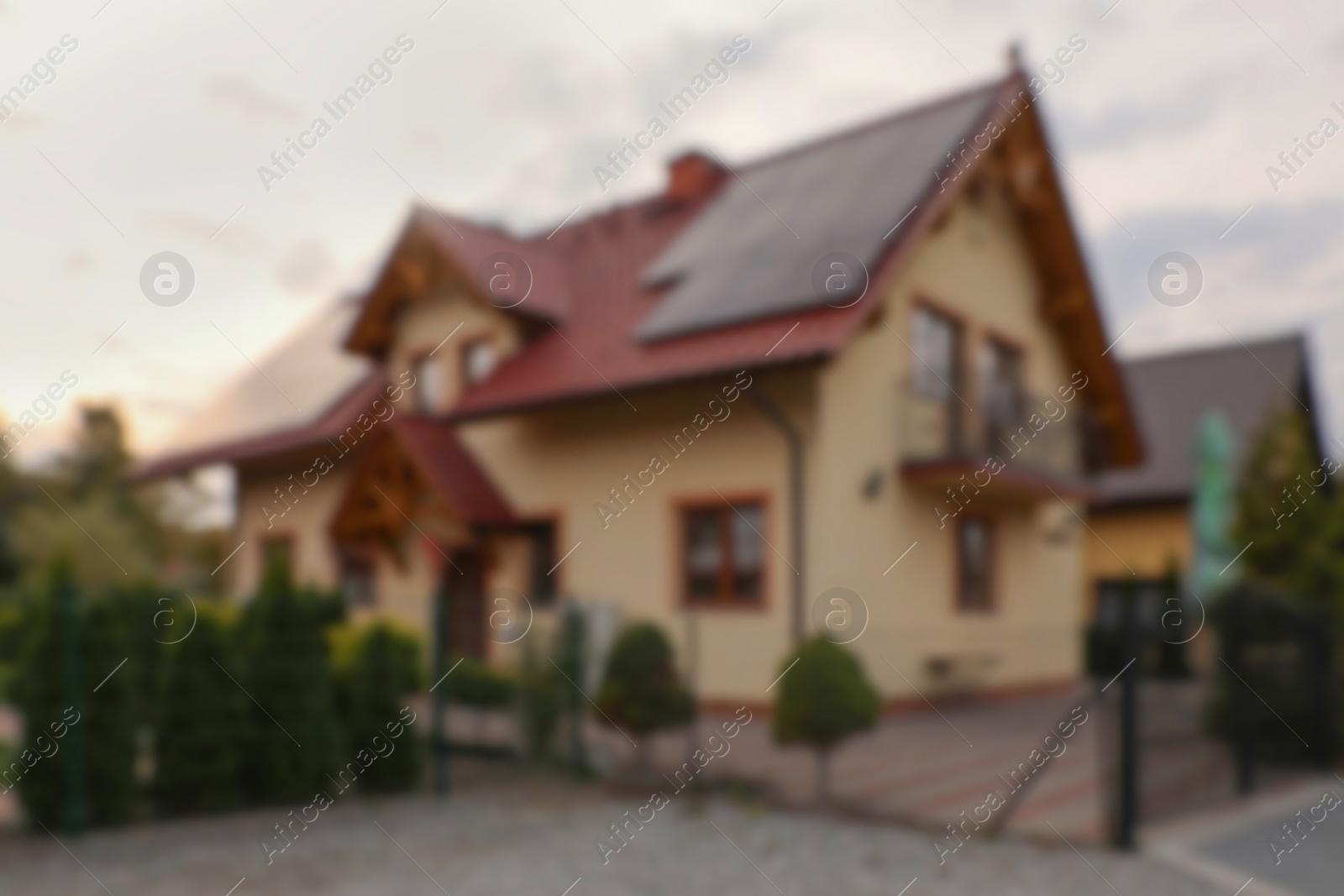 Photo of Beautiful house near fence outdoors, blurred view. Real estate for rent