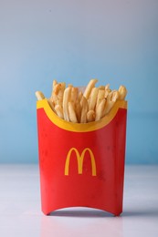 MYKOLAIV, UKRAINE - AUGUST 12, 2021: Big portion of McDonald's French fries on white table