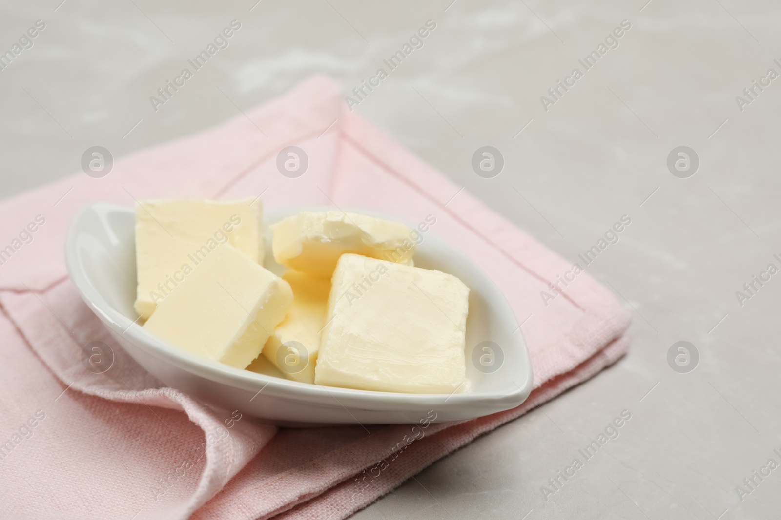 Photo of Plate with tasty fresh butter on table