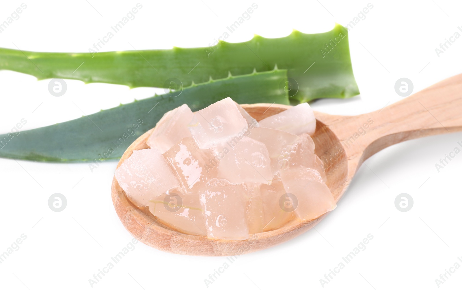 Photo of Aloe vera gel in spoon and slices of plant isolated on white, closeup