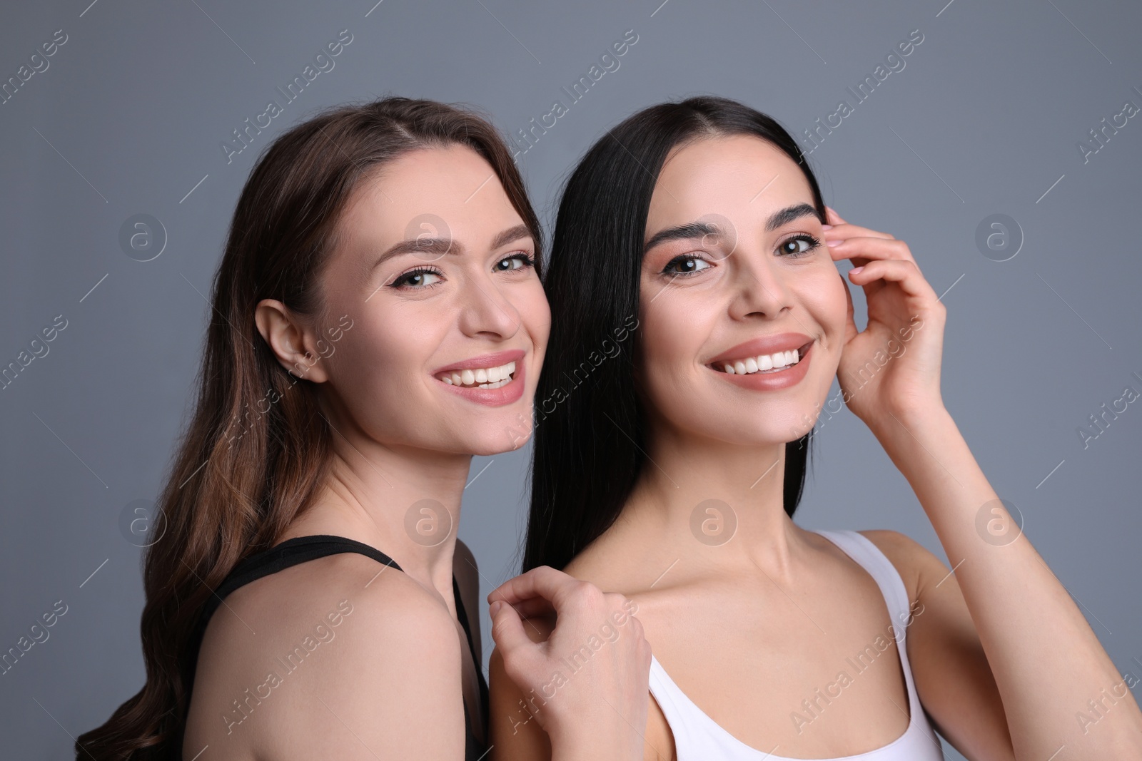 Photo of Portrait of beautiful women on grey background