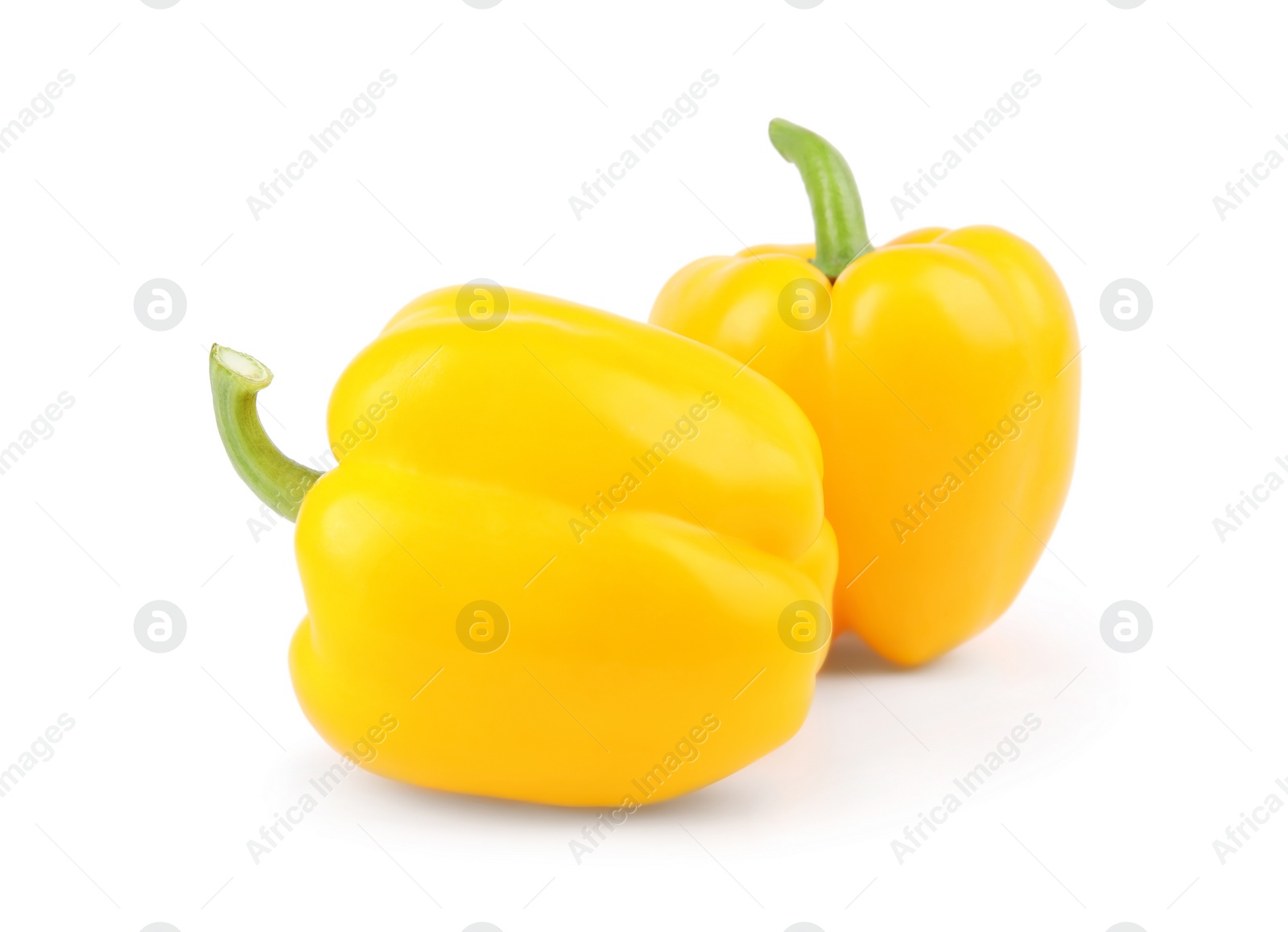 Photo of Ripe yellow bell peppers isolated on white