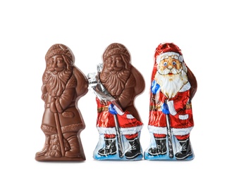 Photo of Sweet chocolate Santa Claus candies on white background