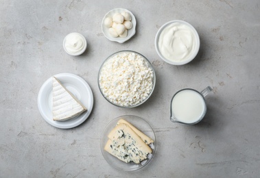 Photo of Flat lay composition with fresh dairy products on gray background