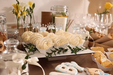 Tasty treats on table in room. Baby shower party