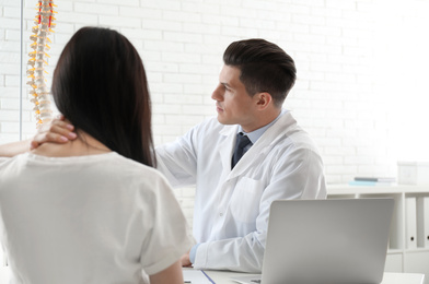 Young woman visiting orthopedist in medical office