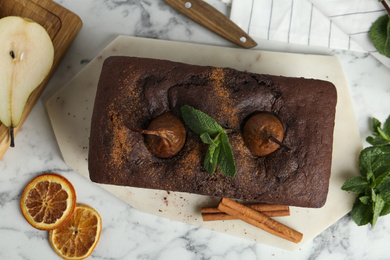 Photo of Flat lay composition with tasty pear bread on white marble table. Homemade cake