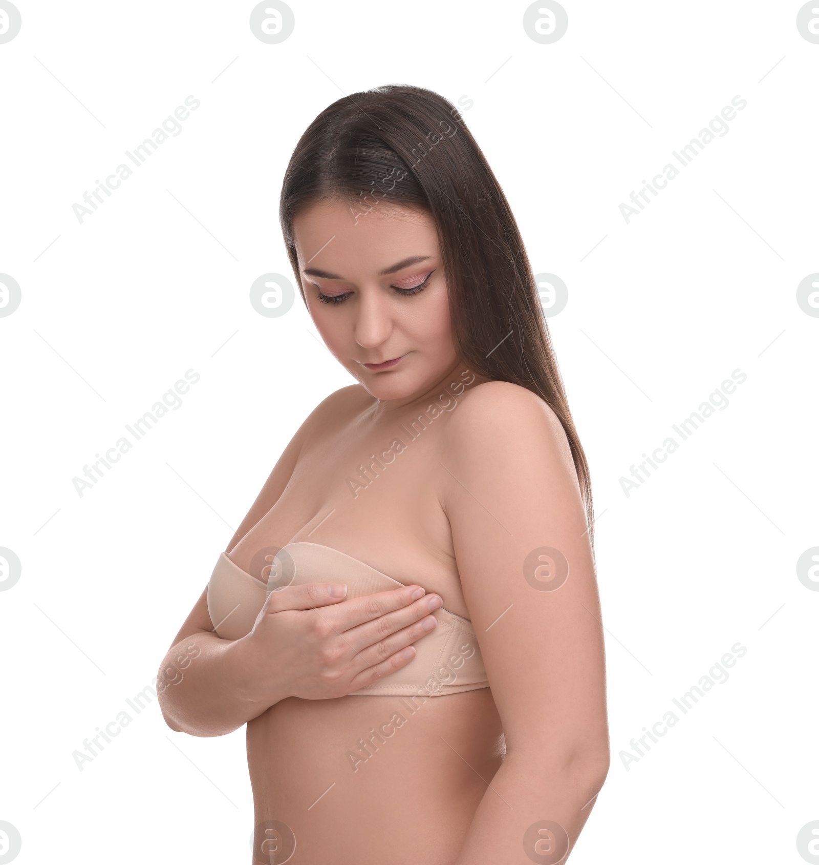 Photo of Mammology. Woman in bra doing breast self-examination on white background