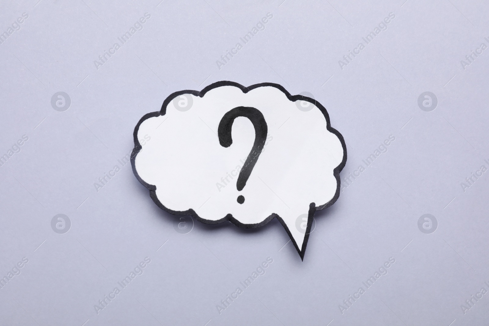 Photo of Paper speech bubble with question mark on light grey background, top view