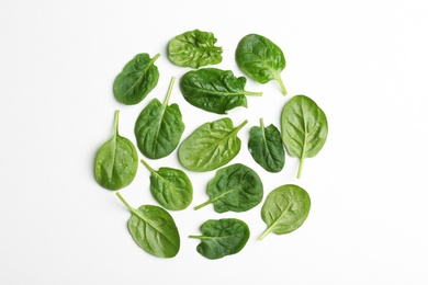 Fresh leaves of spinach isolated on white, top view