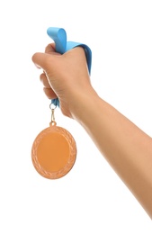 Woman holding gold medal on white background, closeup