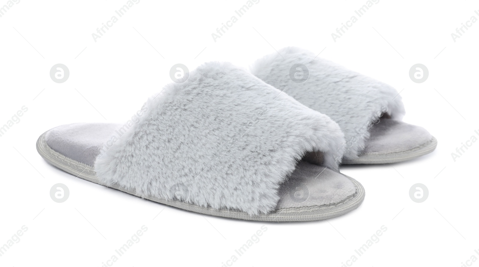 Photo of Pair of soft slippers with fur isolated on white