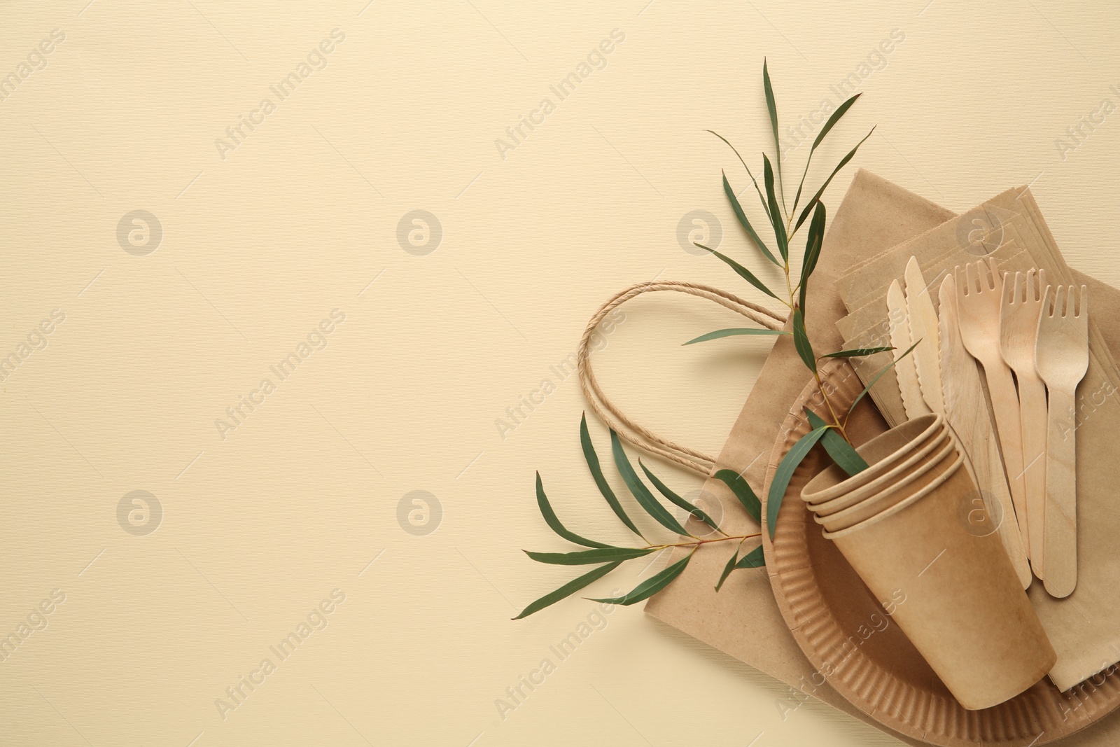 Photo of Flat lay composition with eco friendly products on beige background, space for text