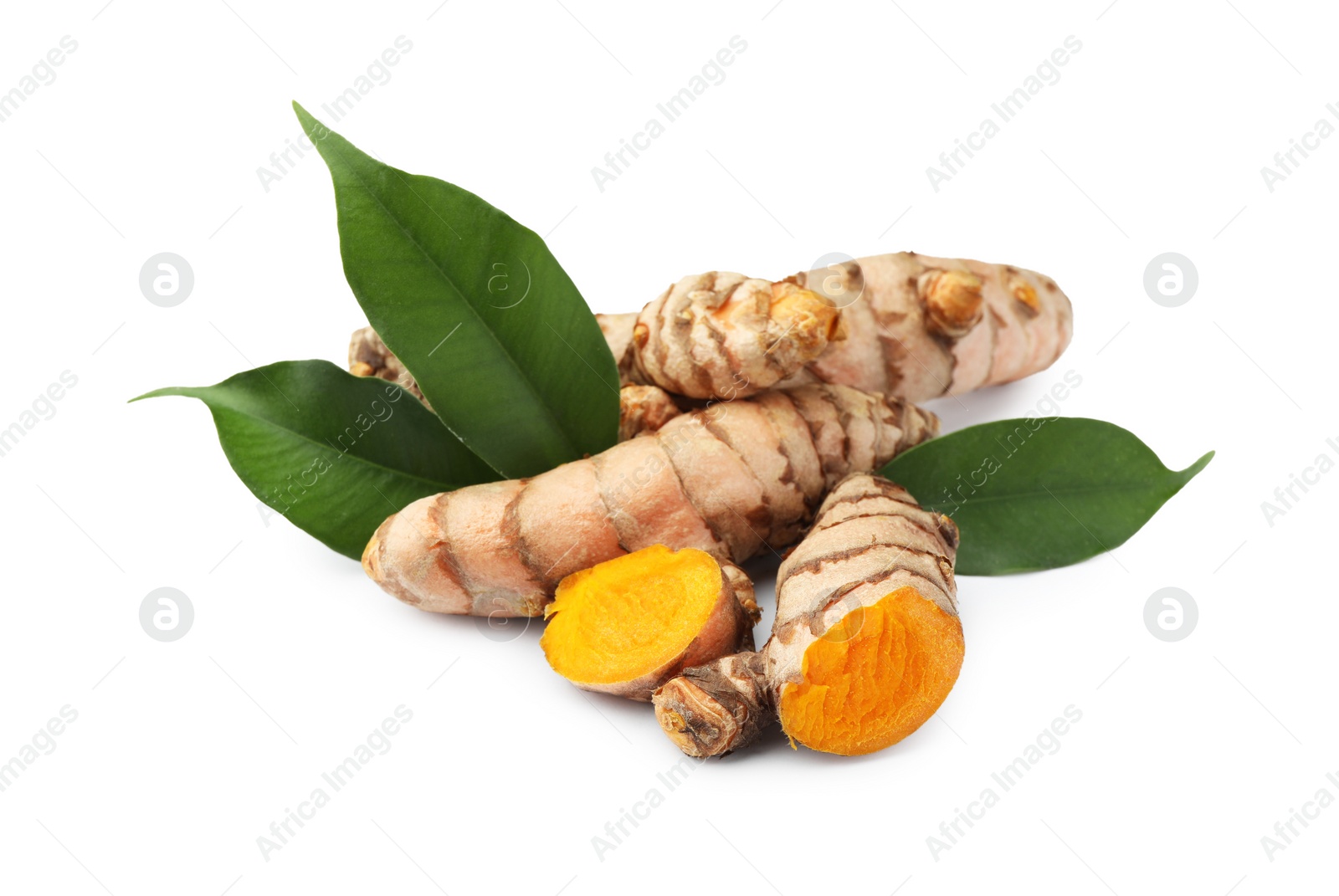 Photo of Fresh turmeric roots and green leaves isolated on white