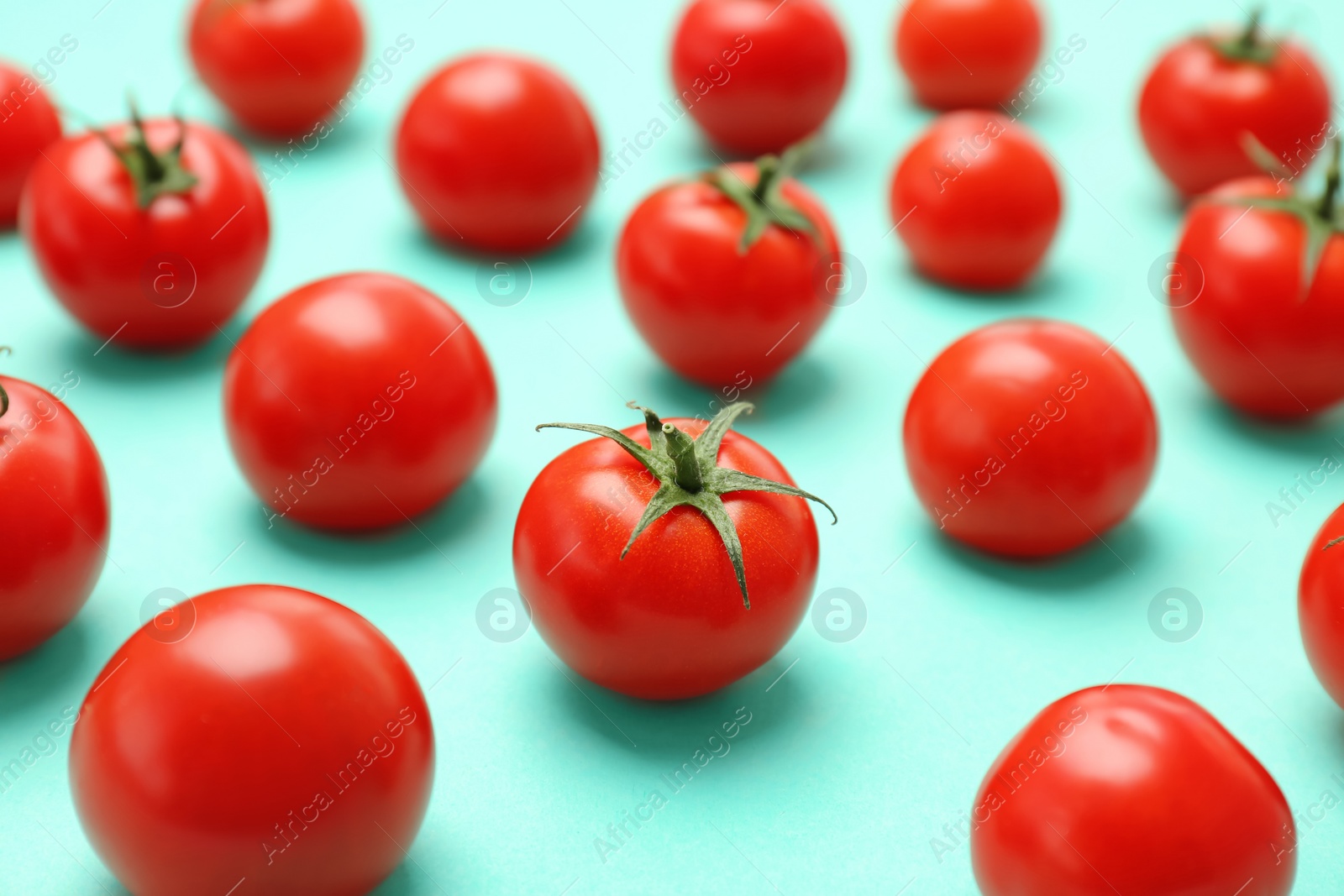 Photo of Fresh ripe red tomatoes on color background