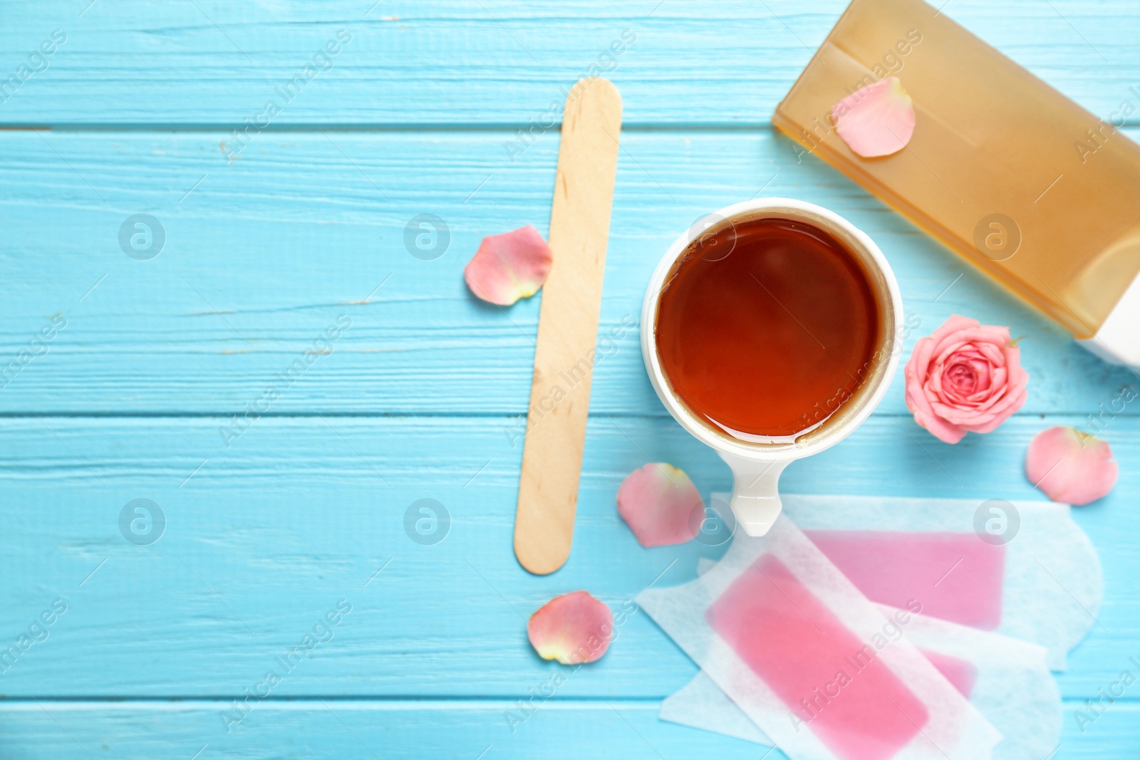 Photo of Set for epilation on wooden background, flat lay