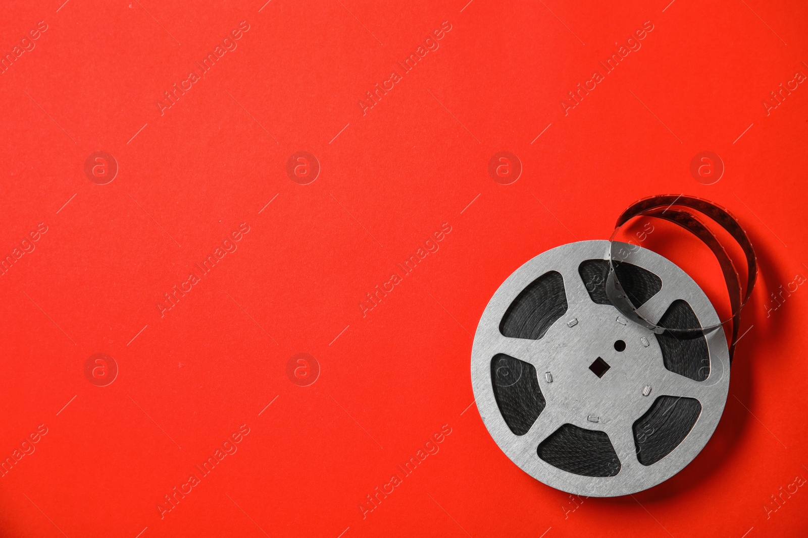 Photo of Movie reel on color background, top view with space for text. Cinema production