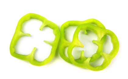 Rings of green bell pepper on white background, top view