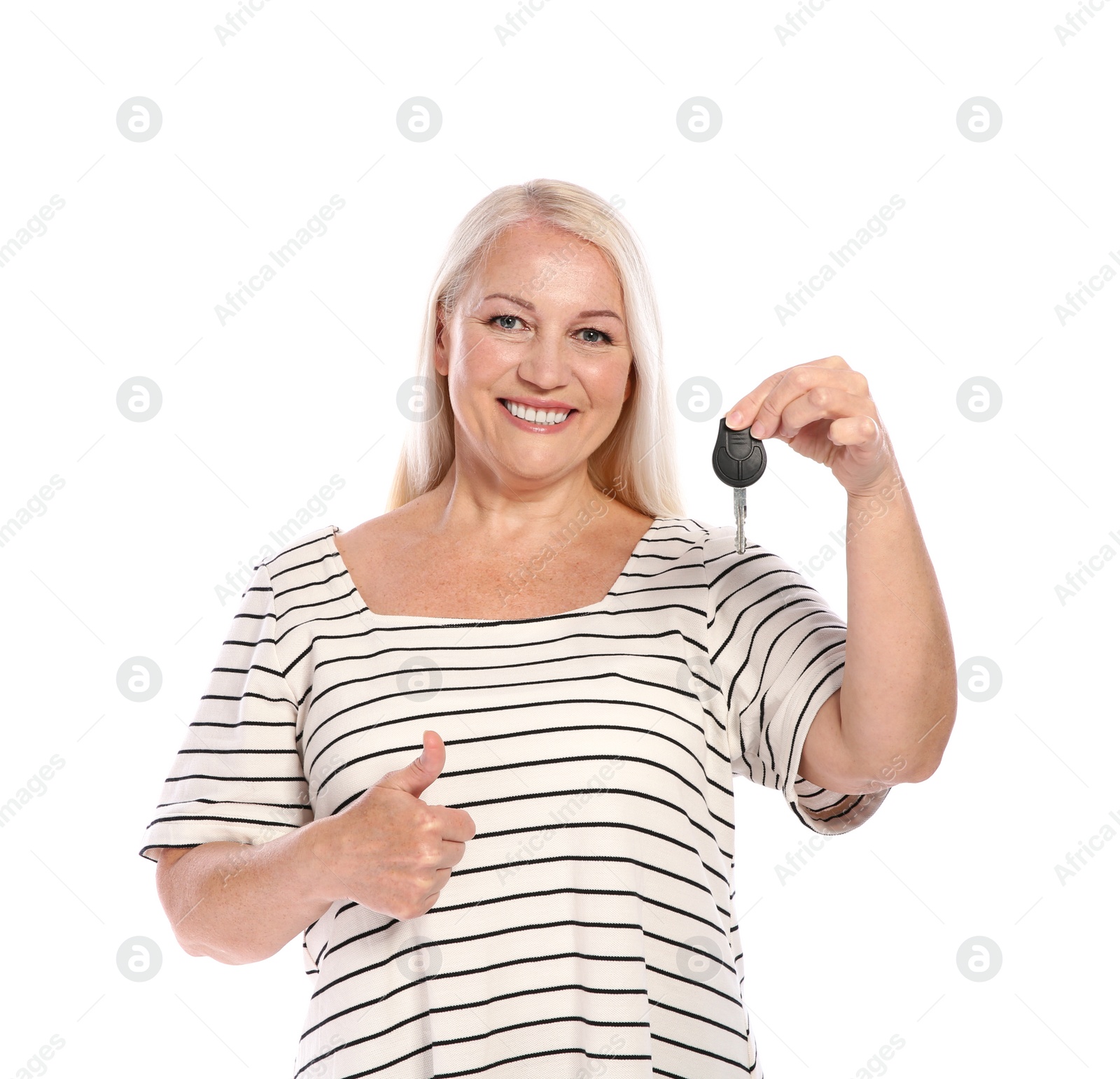 Photo of Happy mature woman with car key on white background. Getting driving license