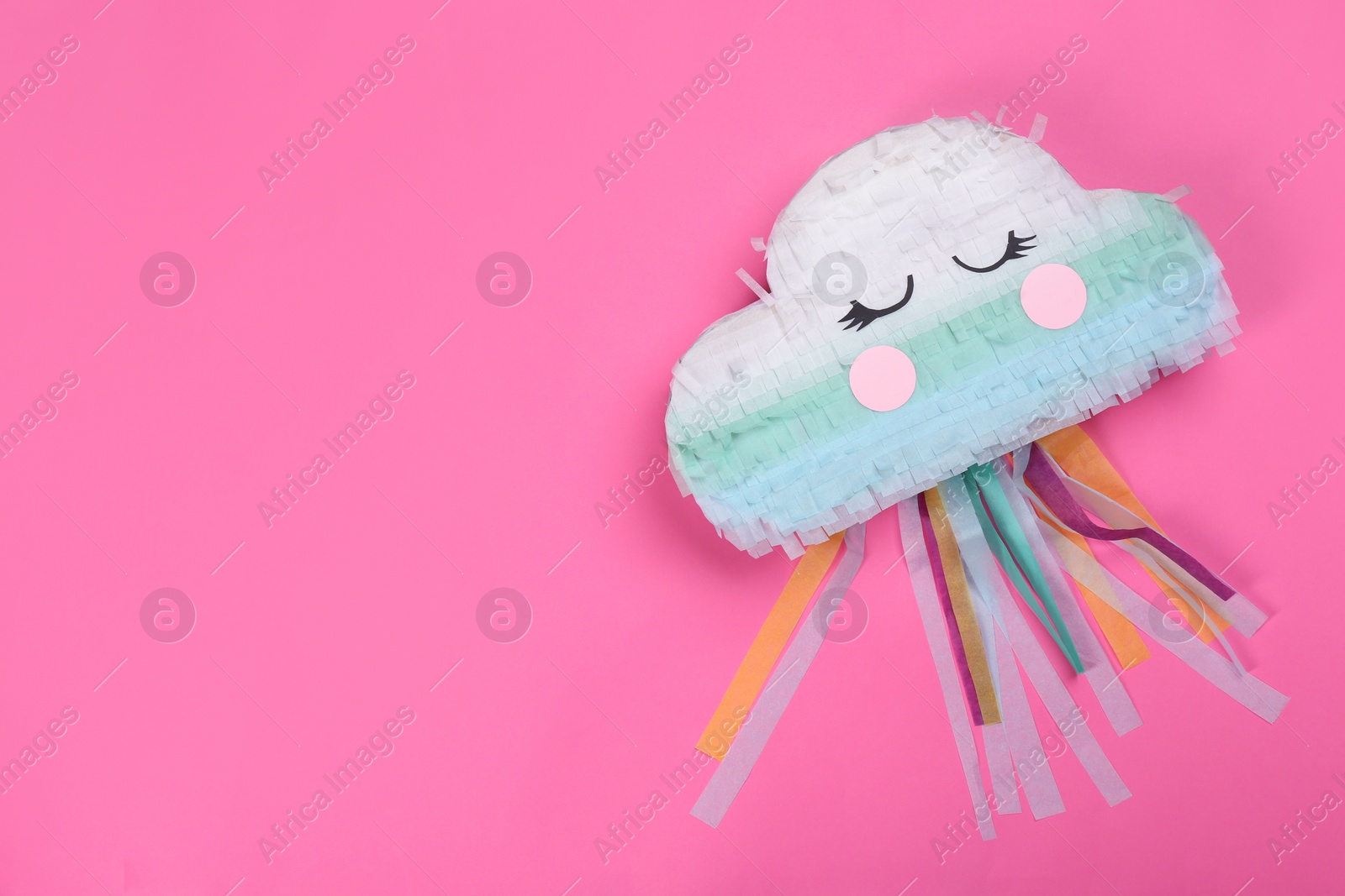 Photo of Bright cloud pinata on pink background, top view. Space for text
