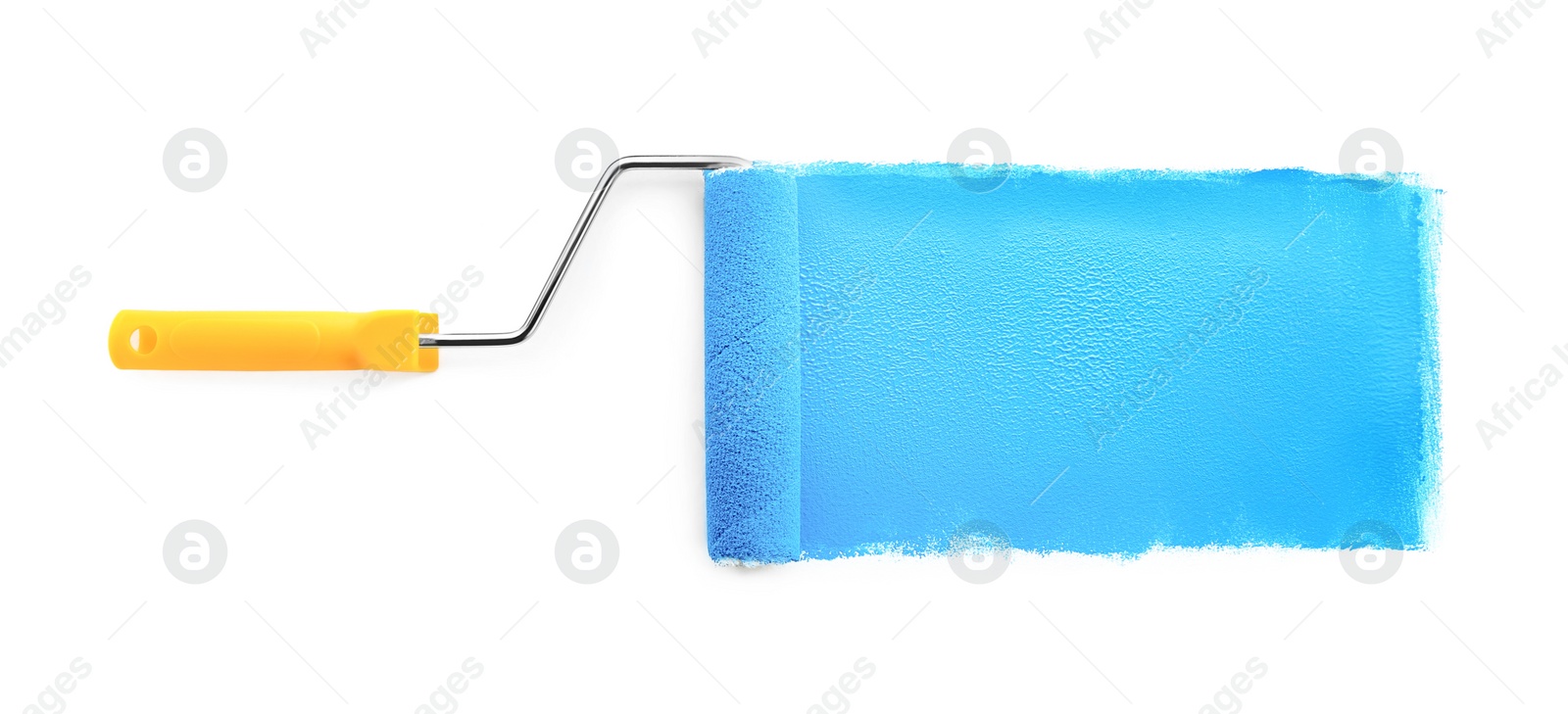 Photo of Roller brush with light blue paint on white background