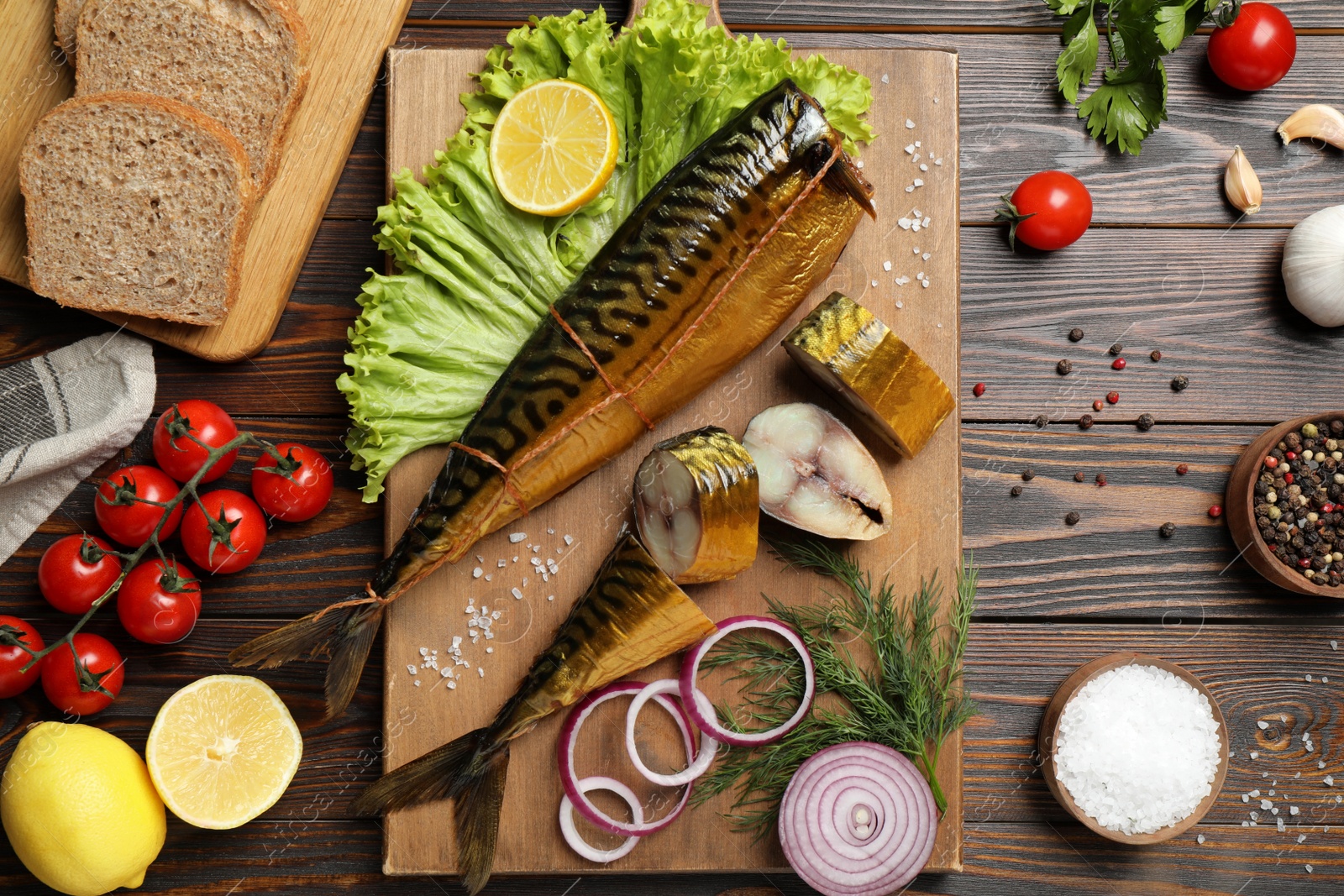 Photo of Flat lay composition with smoked fish on wooden table