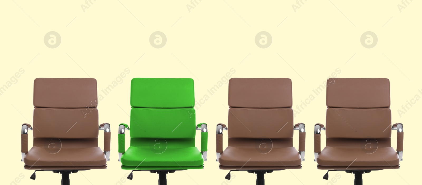 Image of Vacant position. Green office chair among brown ones on beige background, banner design