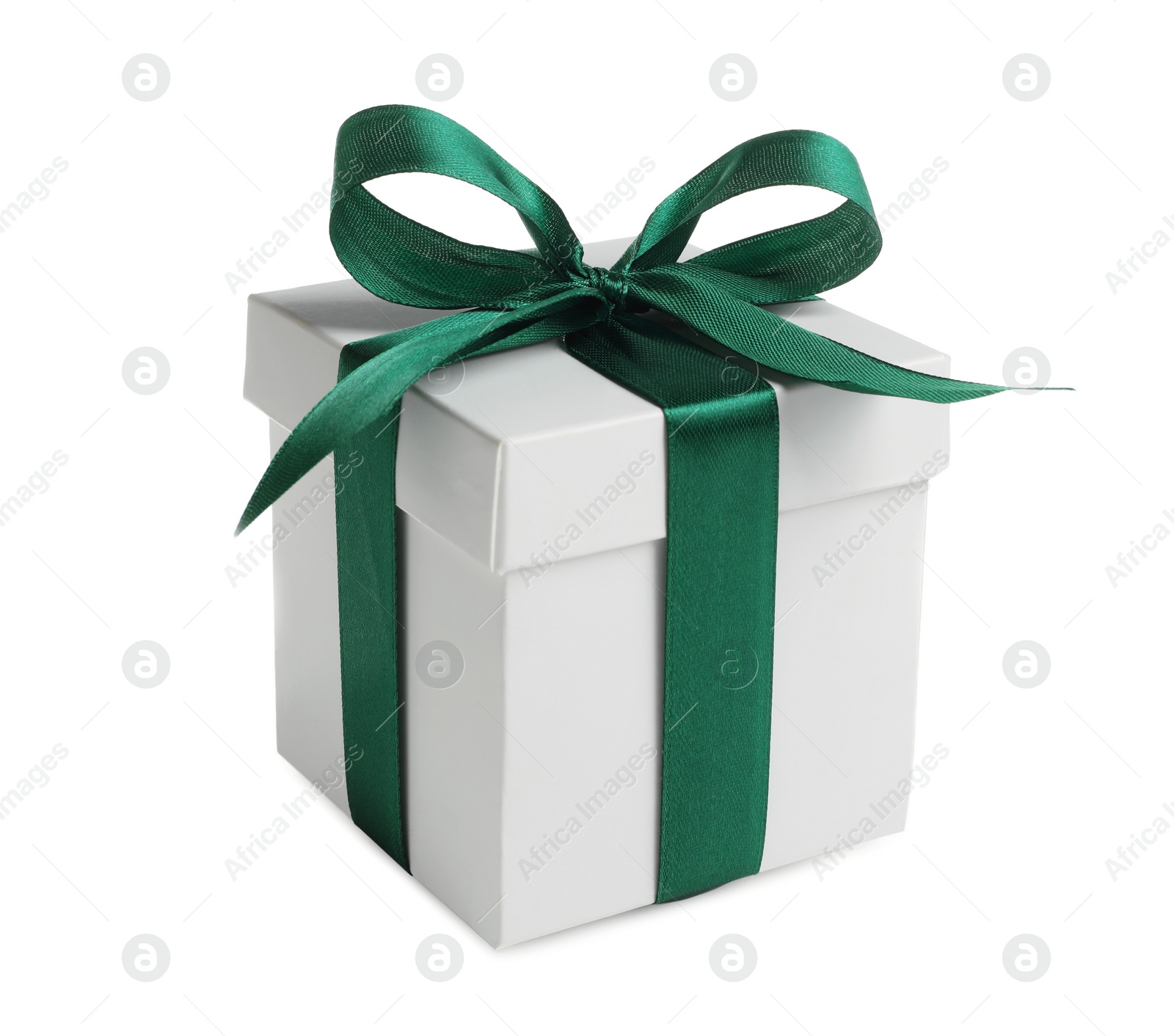 Photo of Christmas gift. Box with green ribbon bow on white background