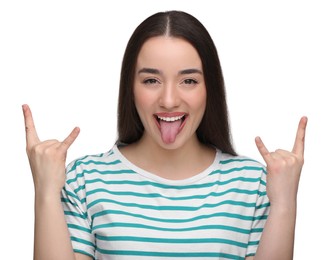 Photo of Happy woman showing her tongue and rock gesture on white background