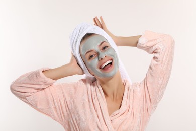 Photo of Woman with face mask on white background. Spa treatments