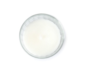 Photo of Wax candle in glass holder on white background, top view