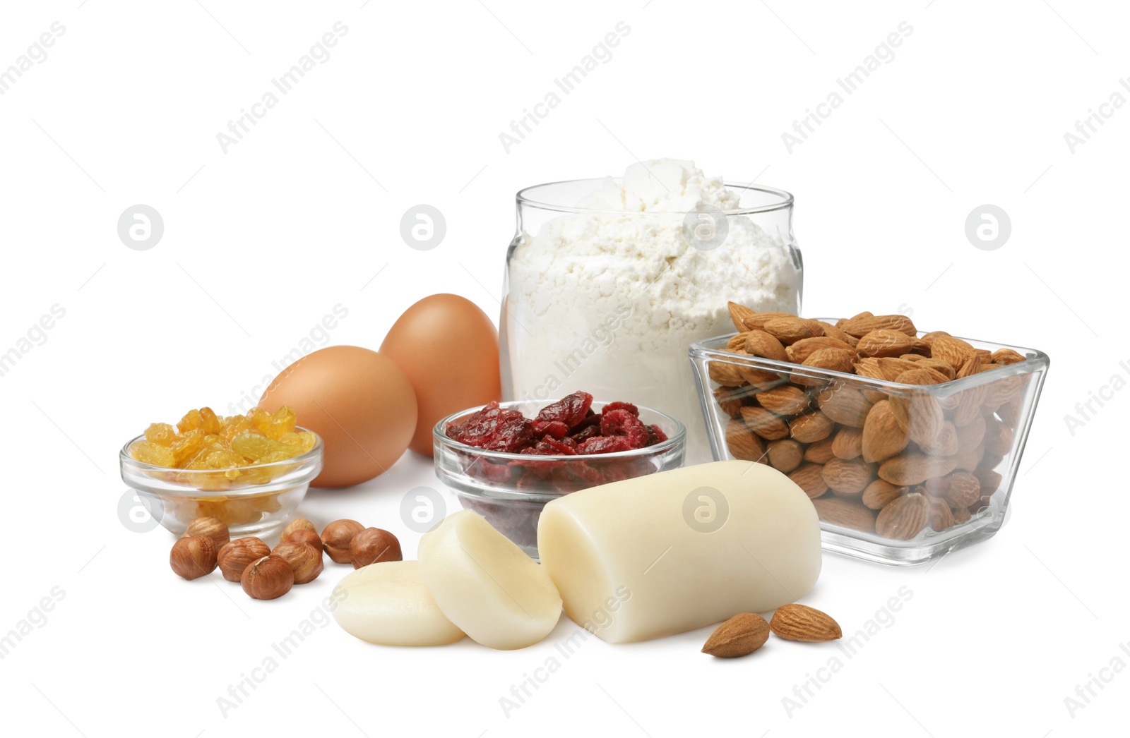 Photo of Marzipan and other ingredients for homemade Stollen on white background. Baking traditional German Christmas bread