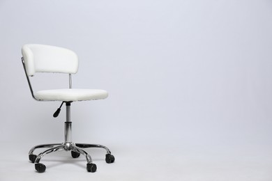 Photo of Comfortable office chair on white background, space for text