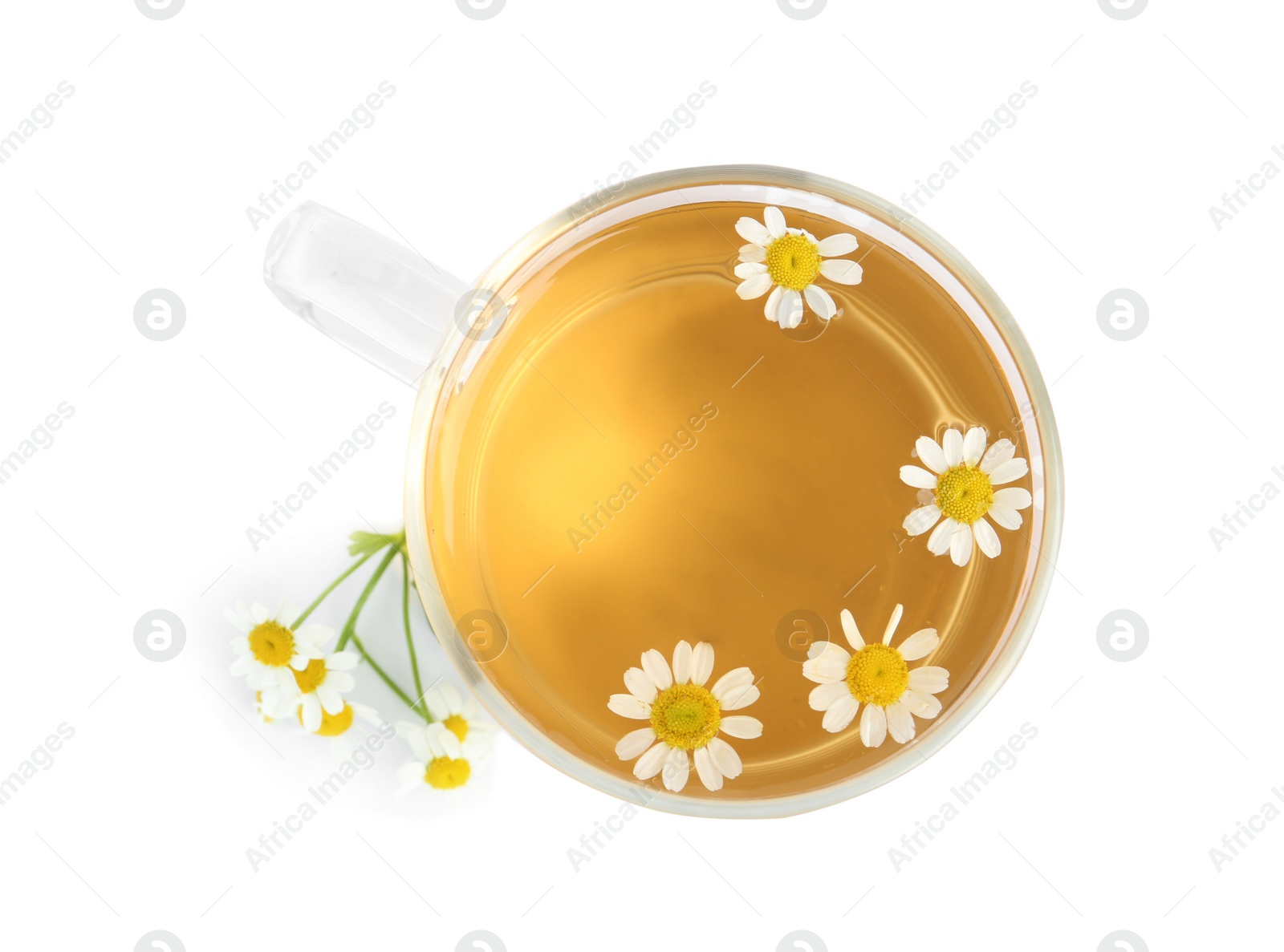 Photo of Delicious chamomile tea in glass cup isolated on white, top view