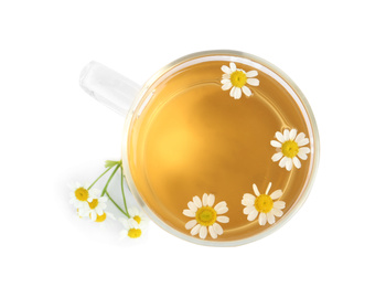 Photo of Delicious chamomile tea in glass cup isolated on white, top view