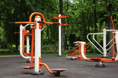 Empty outdoor gym with air walker, ovate stepper, twister and surfer