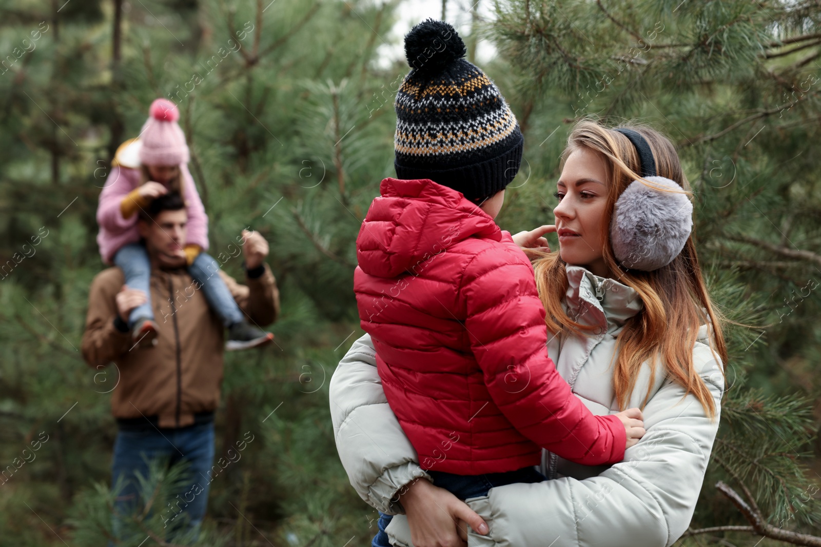 Photo of Happy family spending time together in forest