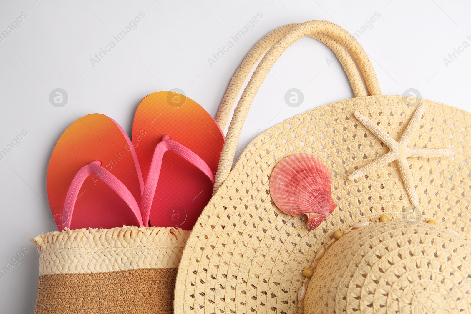 Photo of Flat lay composition with beach accessories on white background