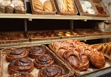 Wicker trays with different sweet buns in bakery