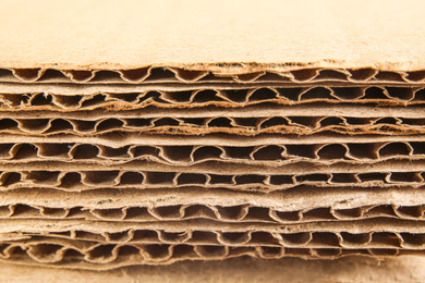 Photo of Sheets of brown corrugated cardboard, closeup view