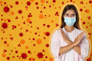 Stronger immunity - better disease resistance. Woman in protective mask showing stop gesture surrounded by viruses on yellow background
