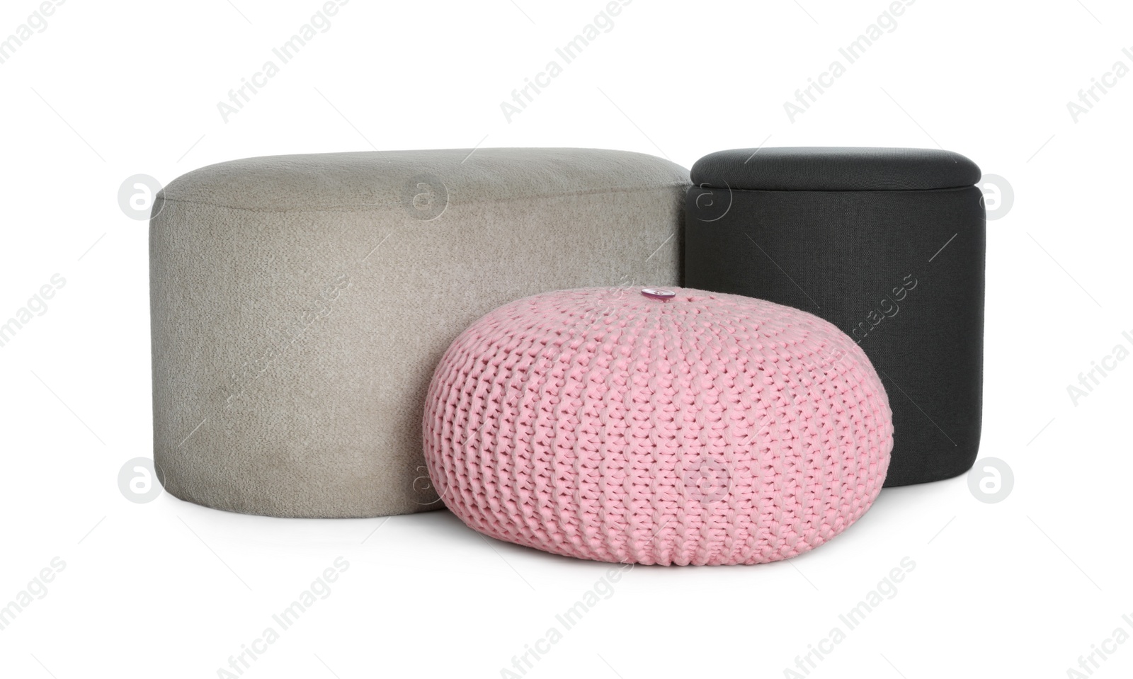 Photo of Different poufs on white background. Home design