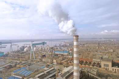 Polluting air with smoke, aerial view of industrial factory. CO2 emissions