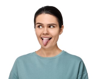 Happy young woman showing her tongue on white background