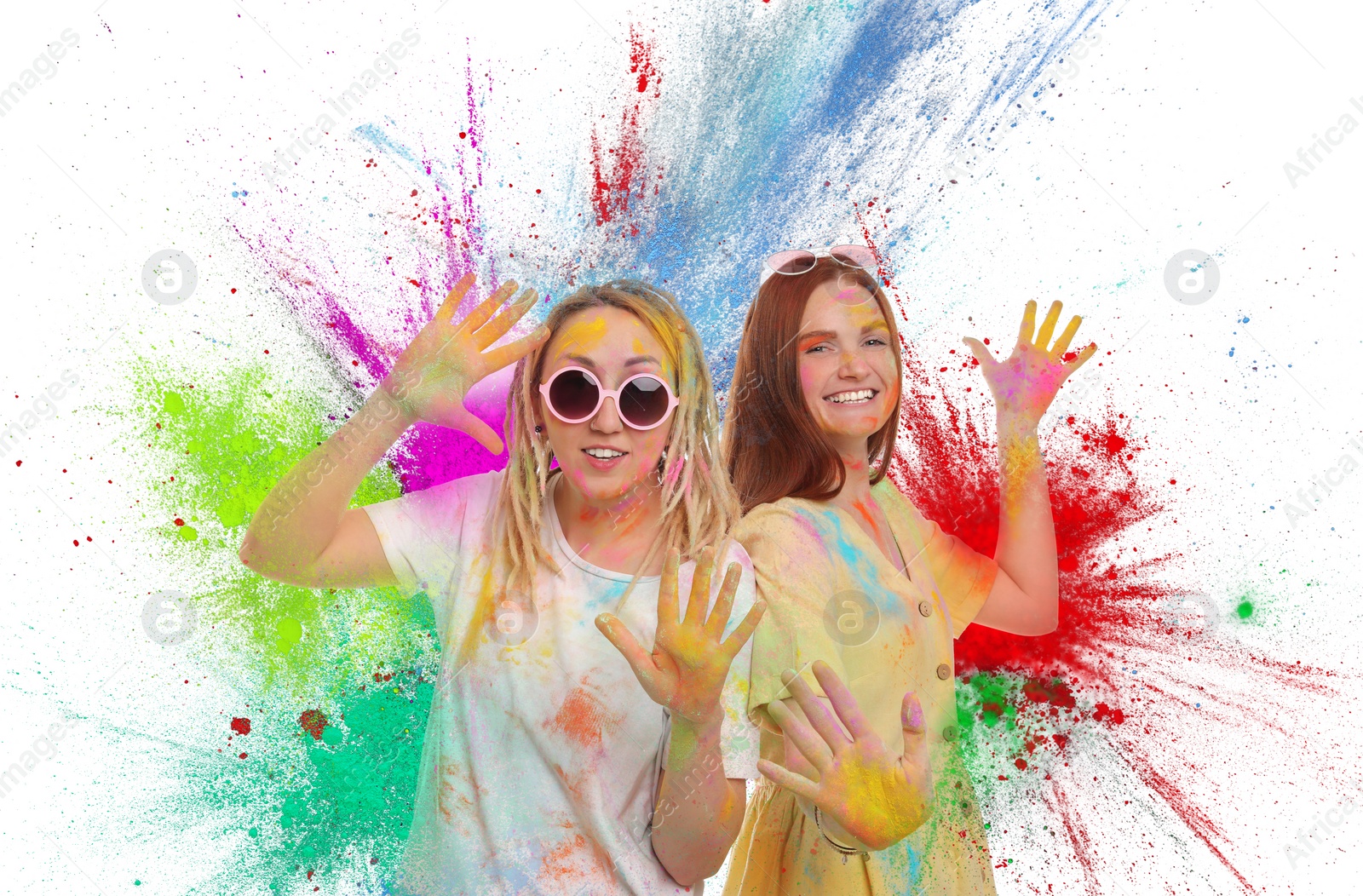 Image of Holi festival celebration. Happy women covered with colorful powder dyes on white background