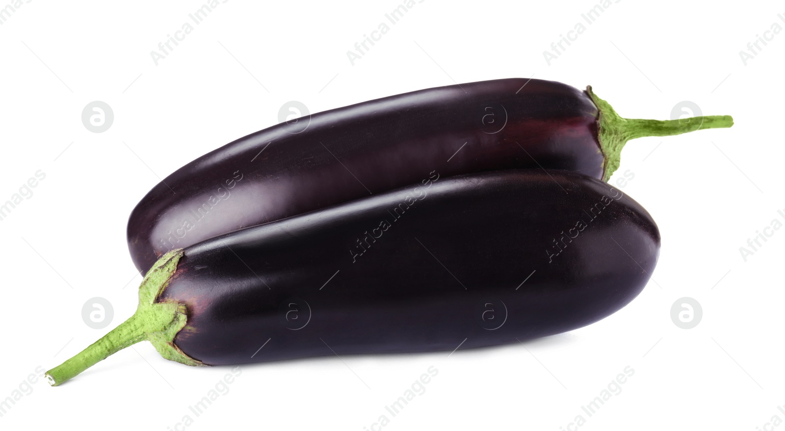 Photo of Tasty raw ripe eggplants isolated on white