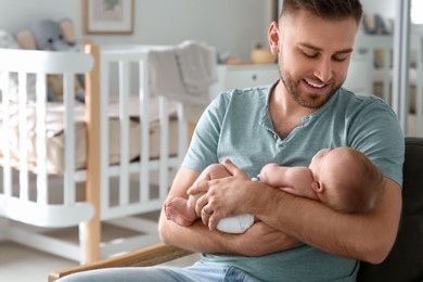 Father with his newborn son at home