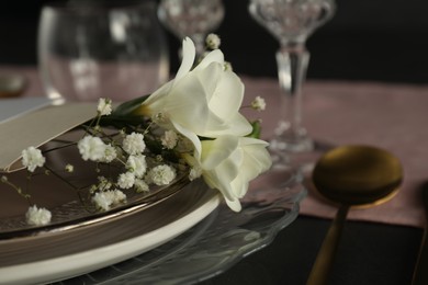 Stylish table setting with floral decor, closeup. Space for text