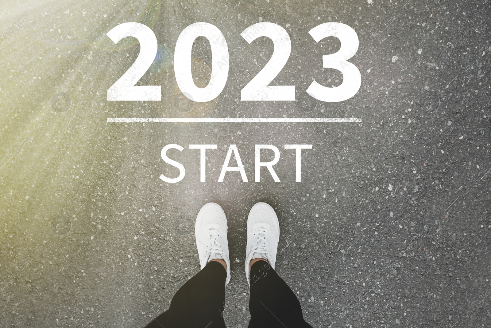 Image of Start new year with fresh vision and ideas. 2021 numbers on asphalt road in front of woman, top view