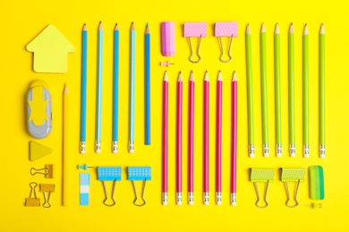 Photo of Flat lay composition with different school stationery on color background